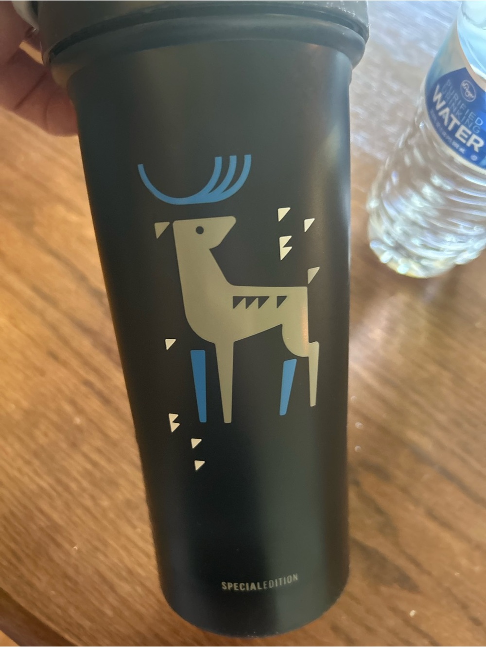 Matte Black Insulated Travel Tumbler with Cream & Blue Reindeer Graphic